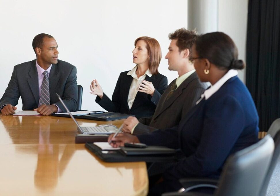 A group of people sitting at a table.